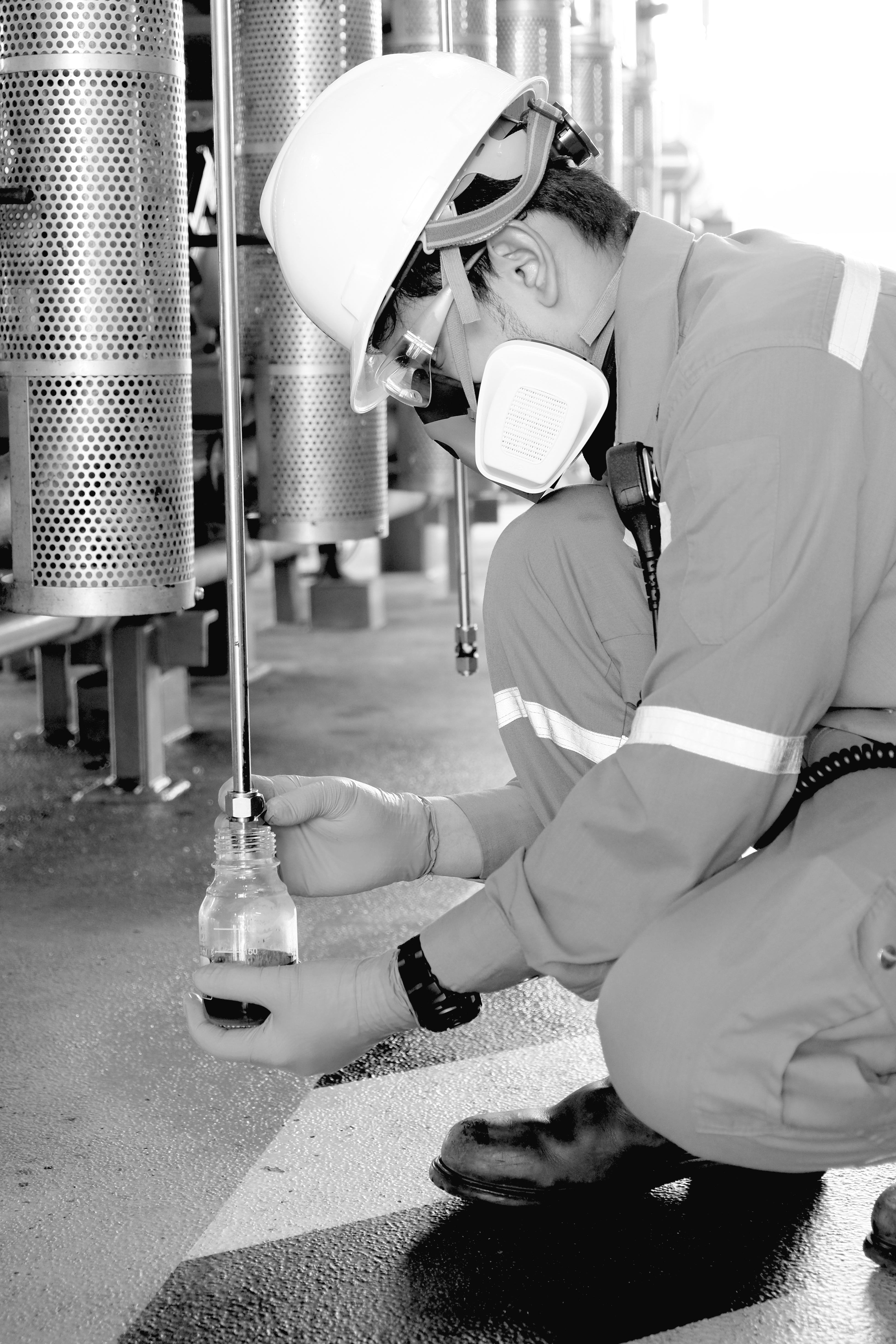 Tribo-Labs oil sample collection — black and white industrial fluid analysis